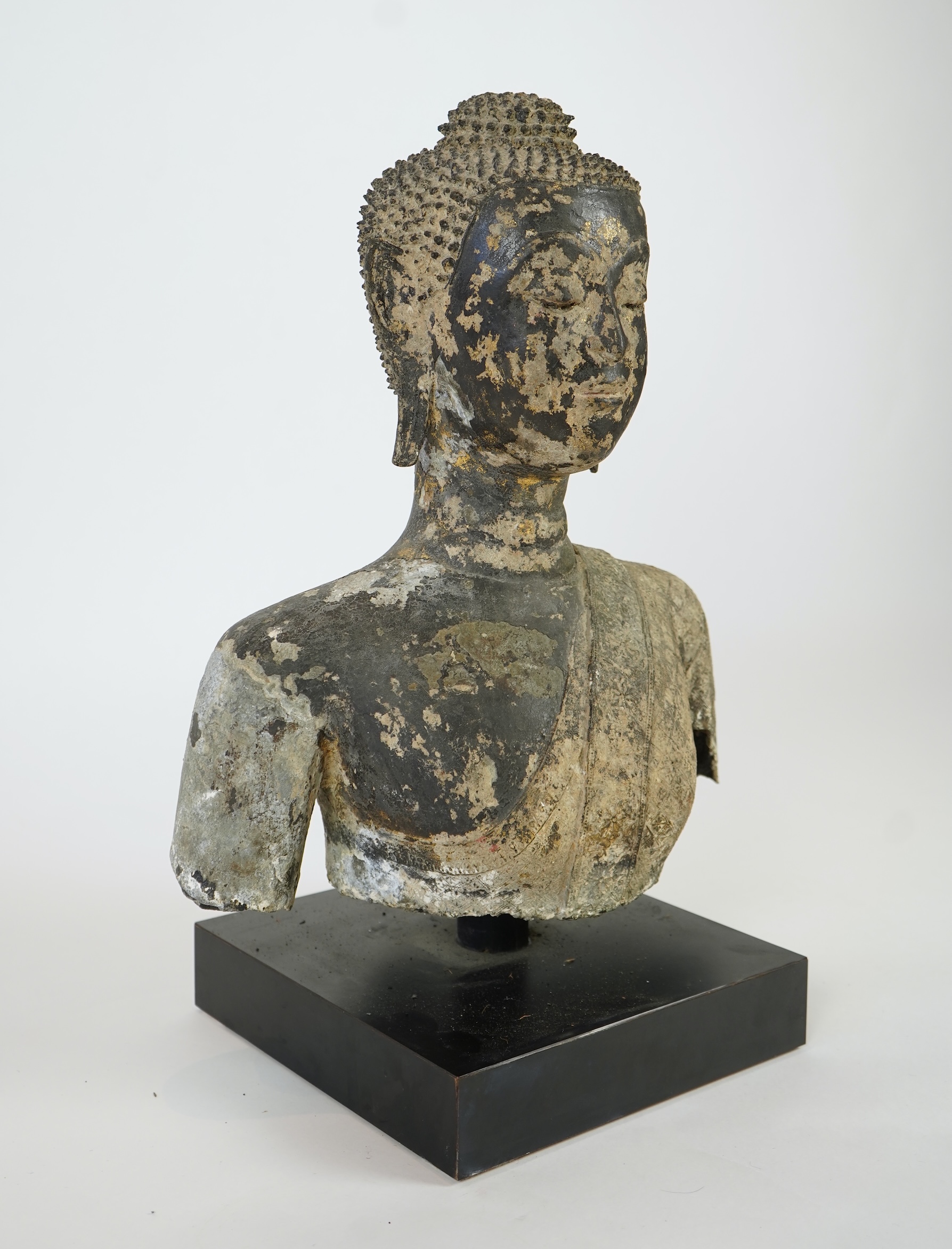 A large Thai lacquered bronze bust of Buddha, 17th/18th century